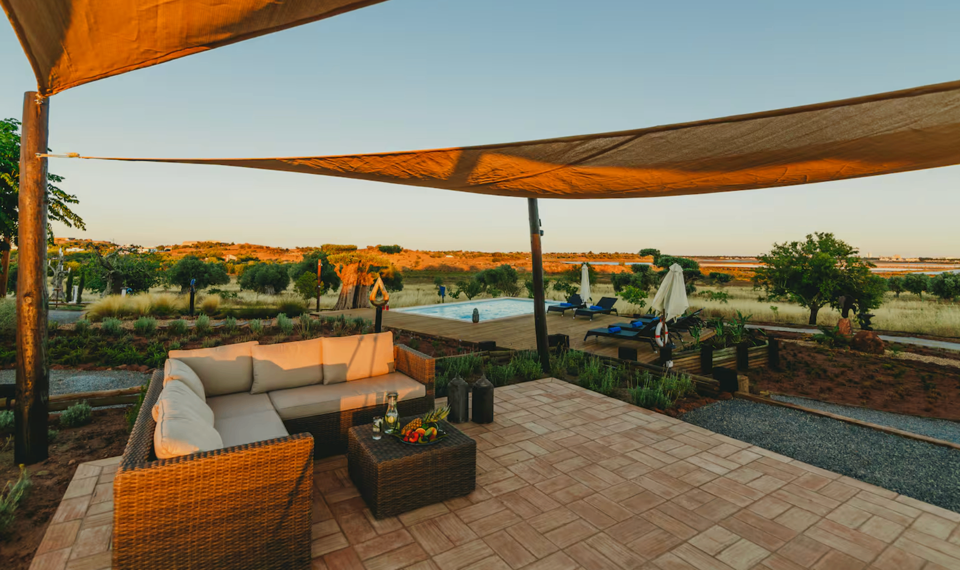 Covered lounge terrace at the retreat during golden hour