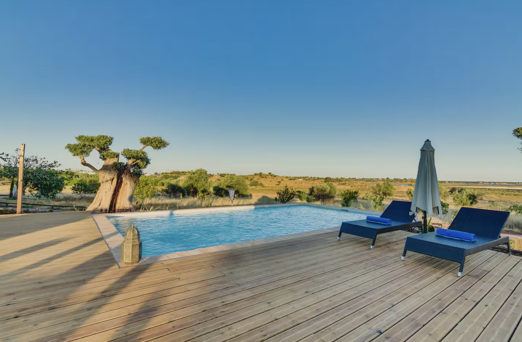 Pool deck with loungers overlooking the Algarve landscape